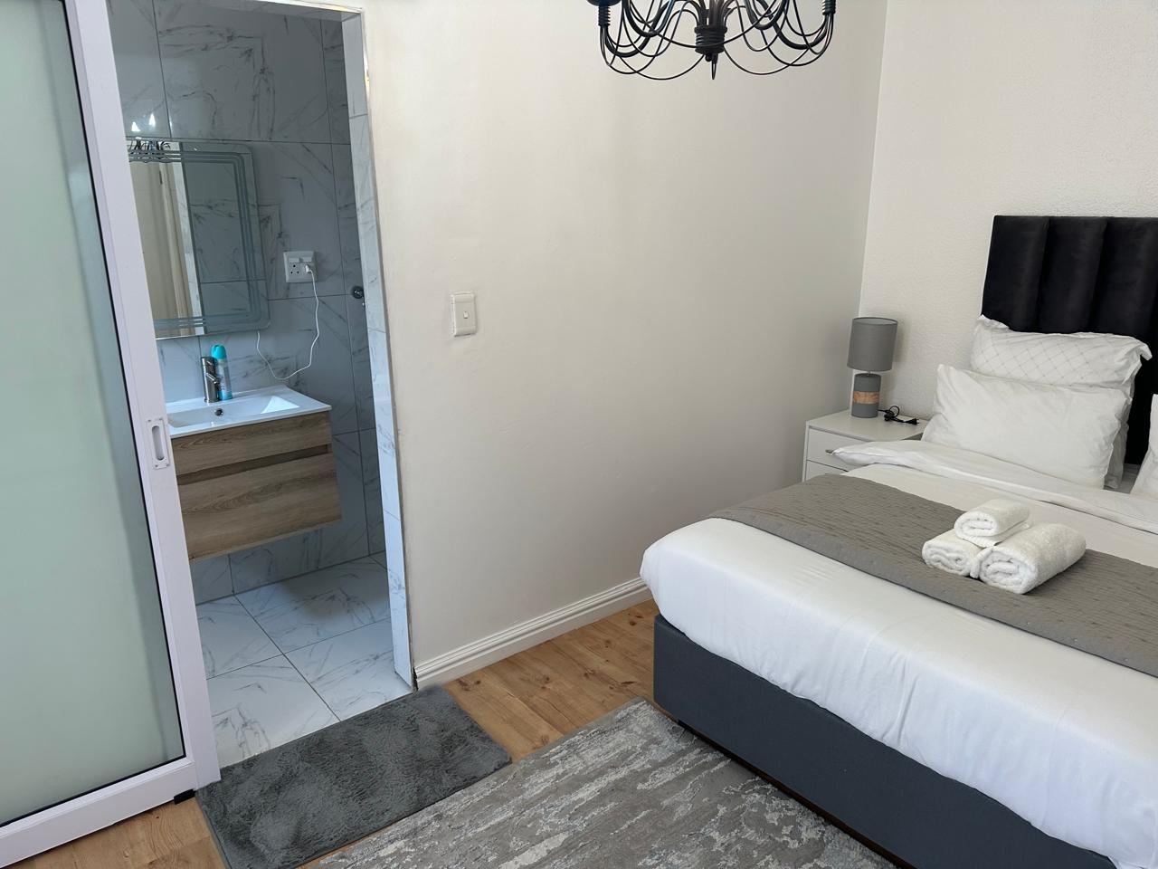 Neat double room with fresh white linen