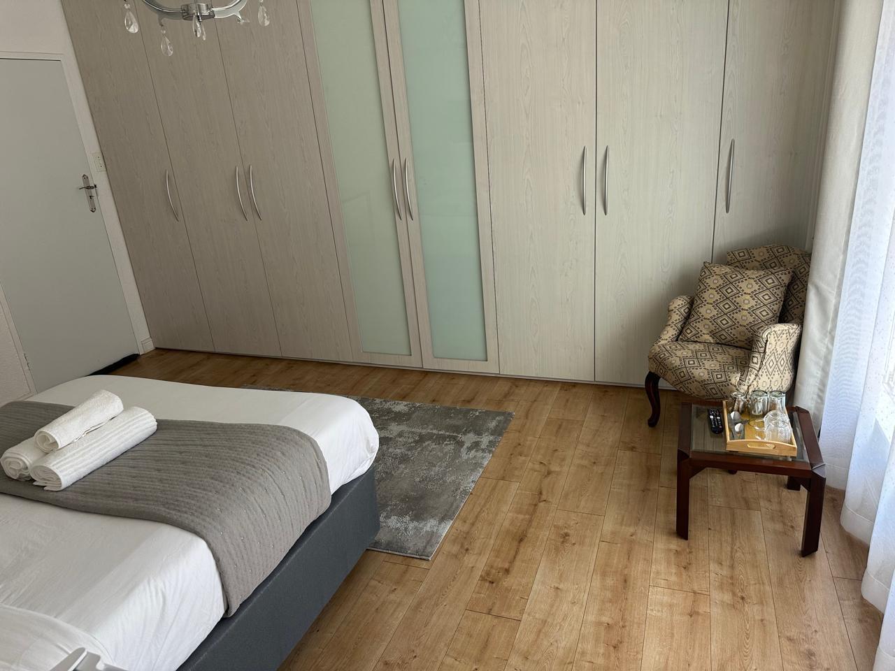 Bedroom with wardrobe and seating