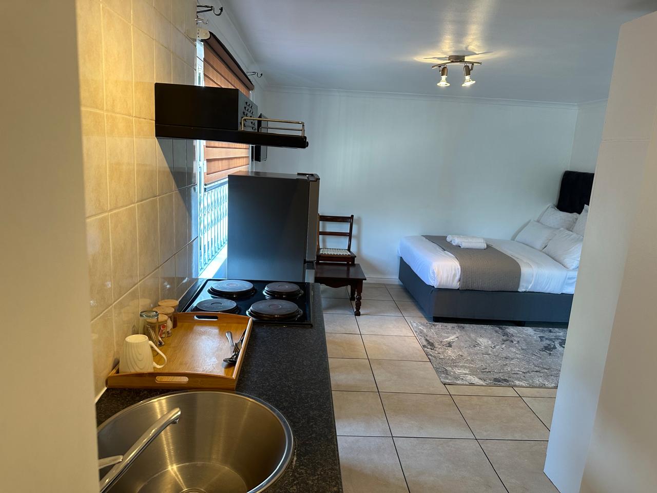 Self-catering room with kitchenette and double bed